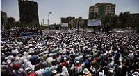  Egyptian Islamist groups led by the ruling Muslim Brotherhood take part in a demonstration to mark the upcoming one year anniversary since President Mohamed Morsi (portrait) was elected. 