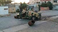  An abandoned Iraqi security forces vehicle on a road in Tikrit 