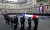  Police carry the coffins of the three officers killed 